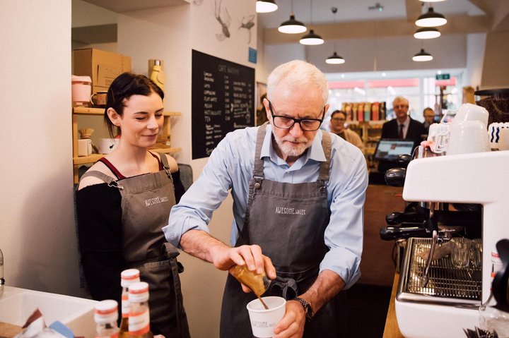 Jeremy Corbyn poring a coffee at a cafe
